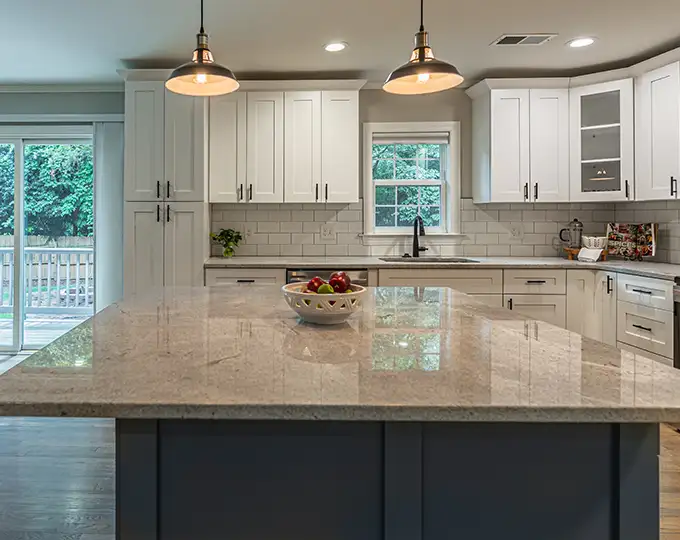 TFH Construction Collinsville IL - Remodeled Kitchen with custom cabinetry, backsplash, appliances, and an island